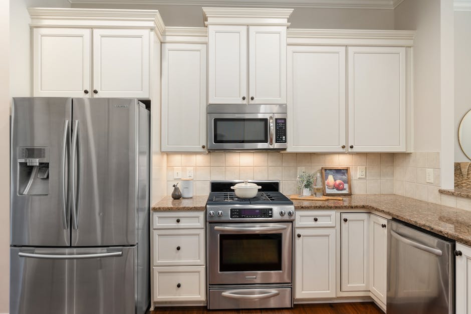 Stainless steel kitchen appliances integrated into custom layout